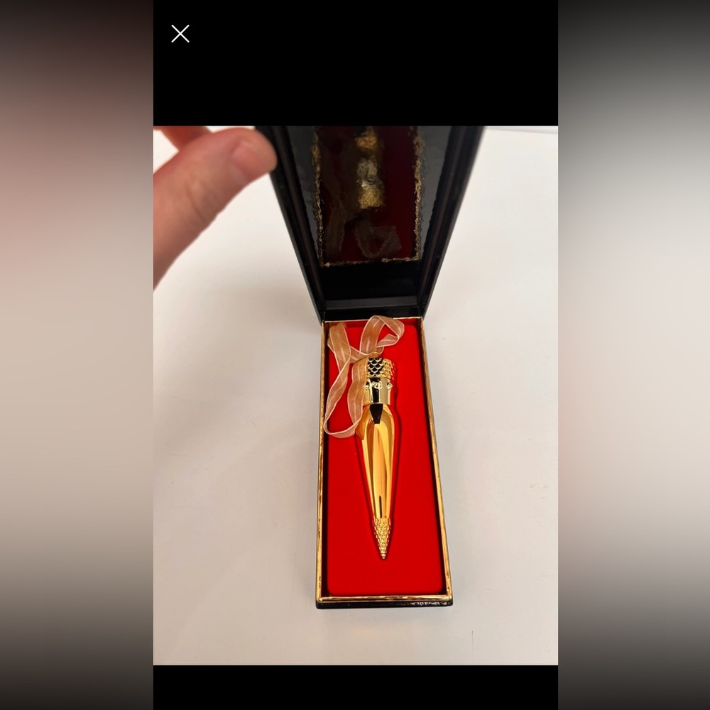 Never used. Christian Louboutin lipstick, necklace